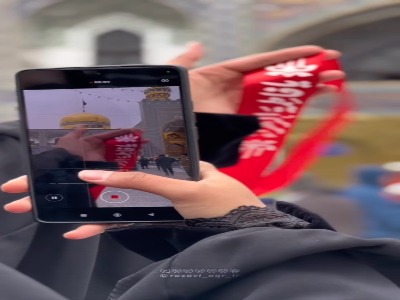 پرچم عزای فاطمی بر فراز گنبد امام رضا(ع) برافراشته شد